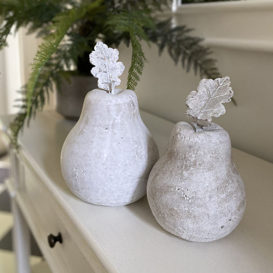 Stone pear medium sculpture with antiqued finish, adding elegance to contemporary decor and interior styling.