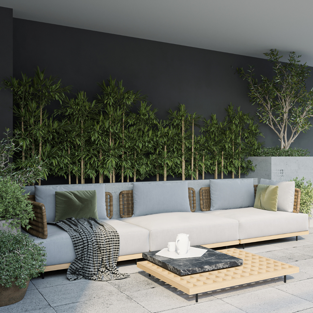 Outdoor Lounge: Modern outdoor space with a gray sectional sofa, green pillows, and a wooden coffee table. Lush plants line the dark wall in the background.