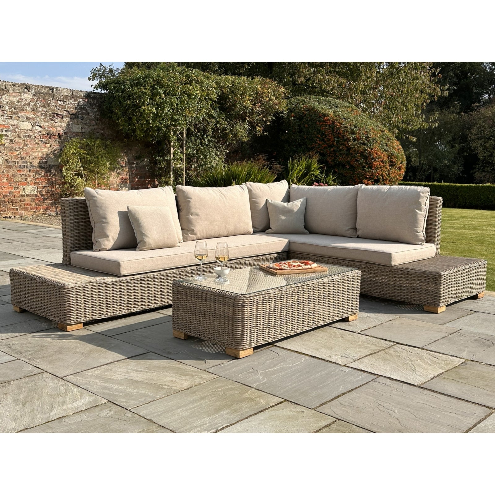 Capri Collection Outdoor Large Corner And Coffee Table Set GLASS Furniture in beige styled interior setting, luxury home decor