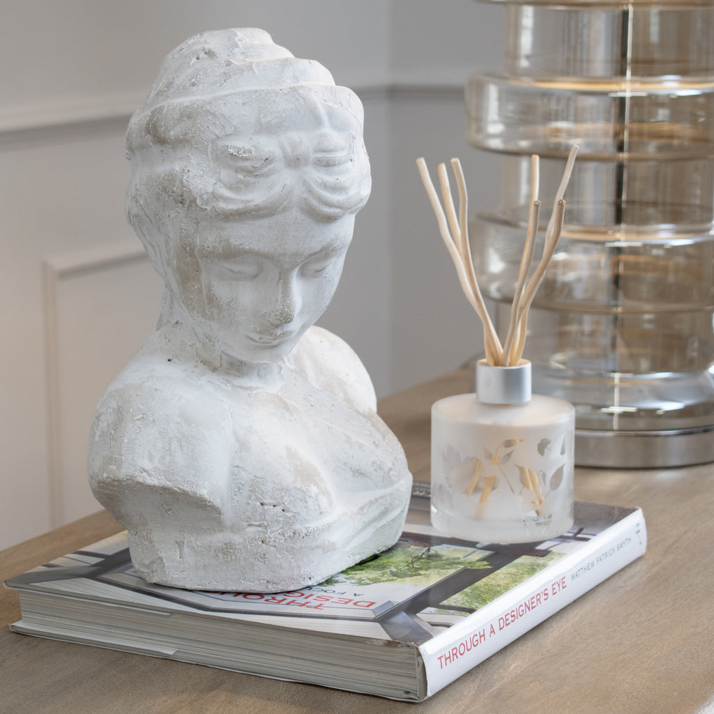 Woman's Head Icon in cream, made from stone